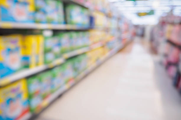 istock Supermarket aisle with diaper shelves abstract blur defocused background 841044904