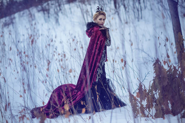 istock Princess in a red cloak in the snow 841048970