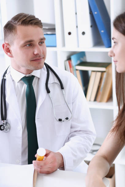 istock Friendly male doctor hold patient shoulder in office 841049038