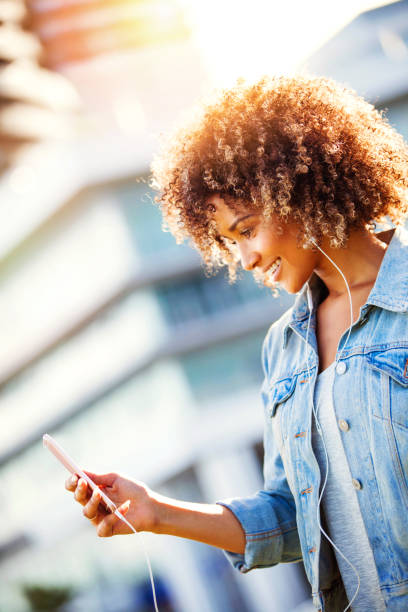 istock Woman using smart phone in the city 841049088