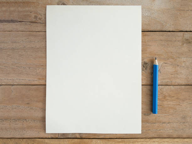 istock Blank paper with pencil on wood table 841049126