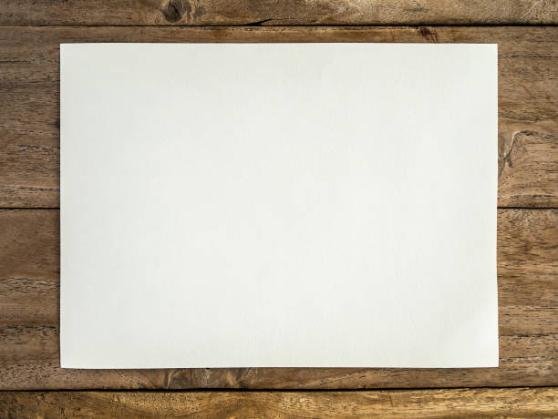 istock Blank white paper on the wooden table 841049132