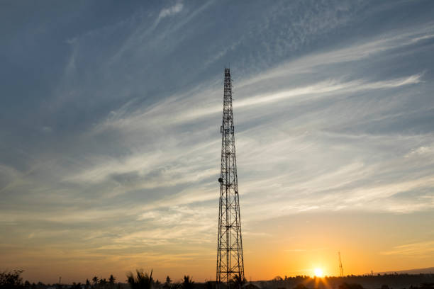 istock Communication antenna tower with colorful sunrise 841050038