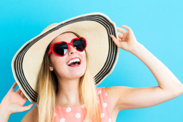 istock Happy woman wearing a hat and sunglasses 841050744