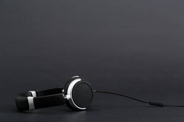 istock Pair of headphones on a black background 841053748