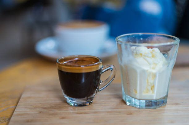 istock Affogato coffee or espresso with icecream on wood texture and blurred background 841053938