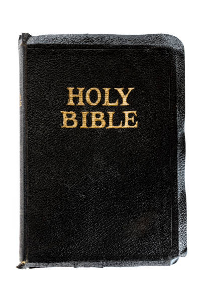 Old Bible isolated on white.  Top view, closed, with gold embossed lettering.