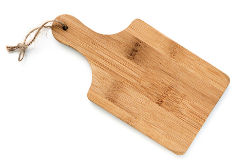Wooden chopping board, isolated on white, top view.