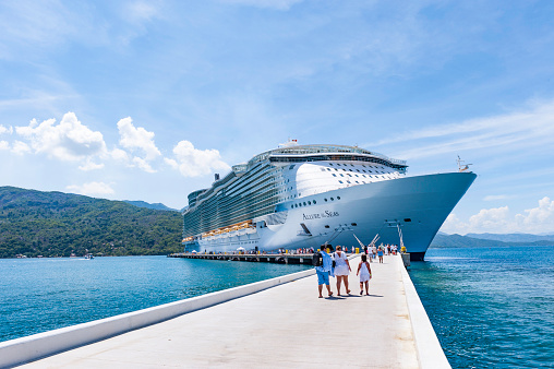 Labadee, Haiti - October 9, 2012: Passengers disembark the Royal Caribbean Cruise ship the Allure of the Seas for a day of beach activities. With a passenger capacity of over 8 thousand, the Allure of the Seas is the largest cruise ship in the world to date.