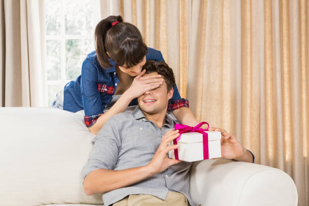 istock Young man receiving a surprise gift 841083460