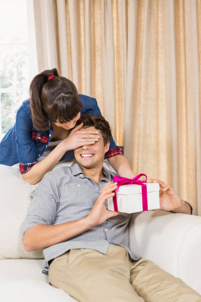 istock Young man receiving a surprise gift 841083474