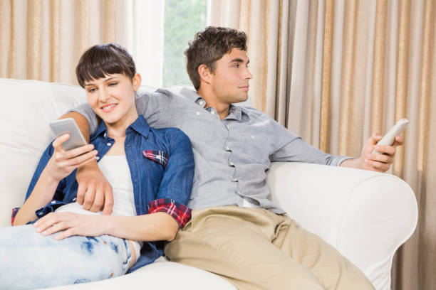 istock Couple at home relaxing on the sofa 841083542