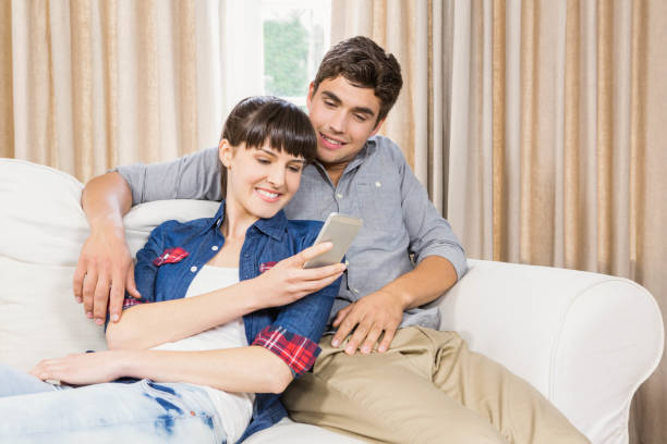 istock Couple at home relaxing on the sofa 841083554
