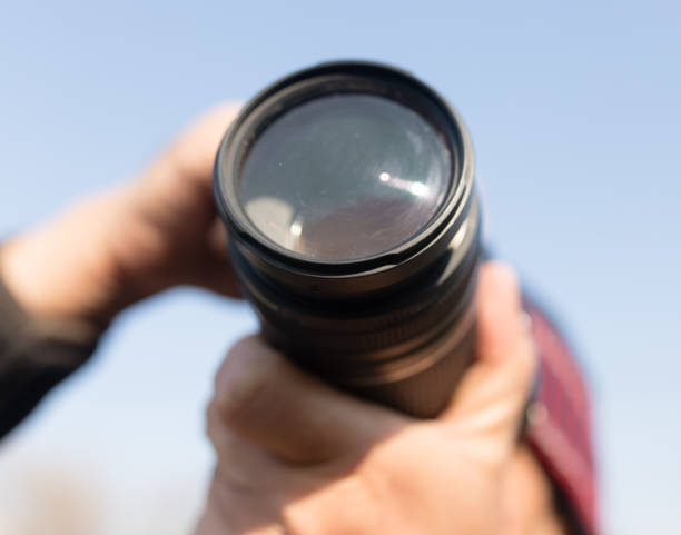 istock A large lens in the camera of a man 841083884