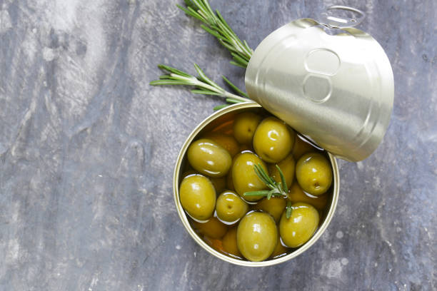 istock Organic canned green olives with rosemary 841086566