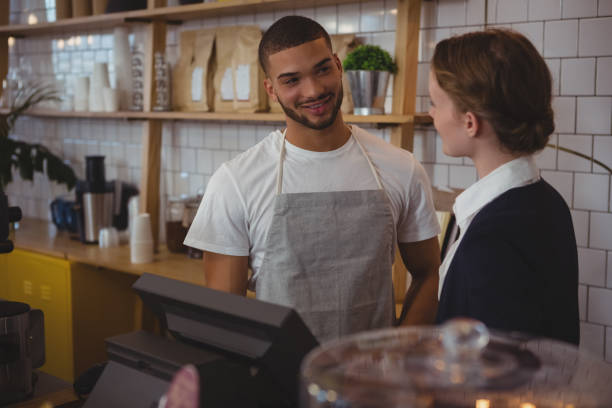 istock Owner talking with waiter in cafe 841091212