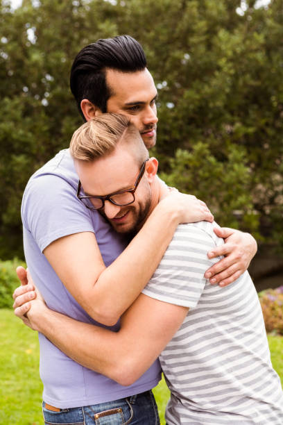 istock Smiling gay couple hugging 841092004