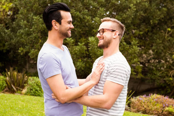 istock Smiling gay couple hugging 841092018