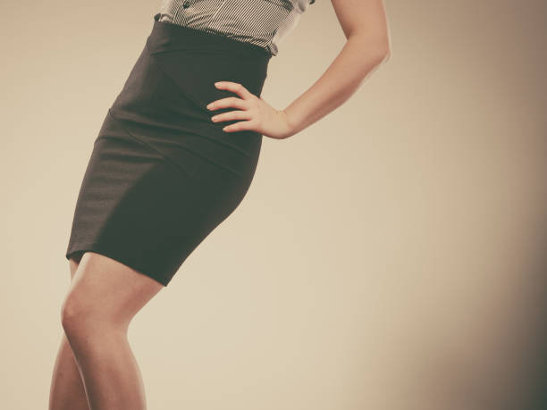 Woman wearing elegant tight dark black skirt stock photo
