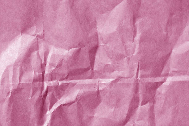 istock Pink color paper sheet surface with wrinckles. 841095852