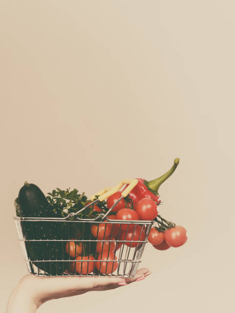 istock Hand holds shopping cart with vegetables 841099126