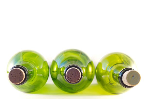 green empty bottles of wine on a white background