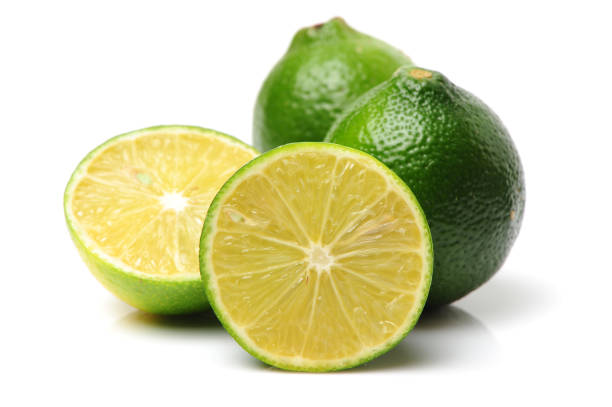 istock whole limes and one halved lime    on a white background 841101692