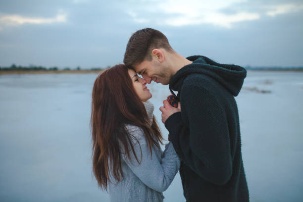 istock Couple kissing outdoors in winter 841113782