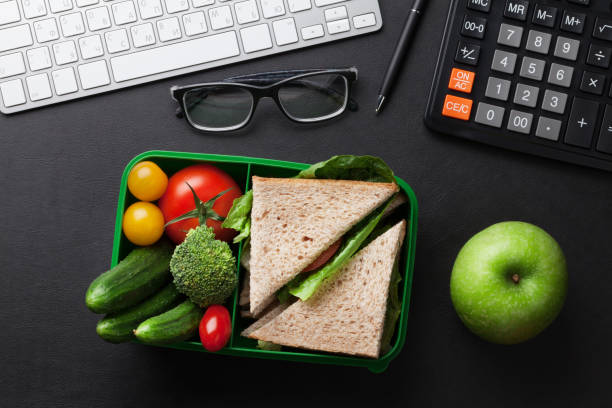 istock Office desk with supplies and lunch box 841117874