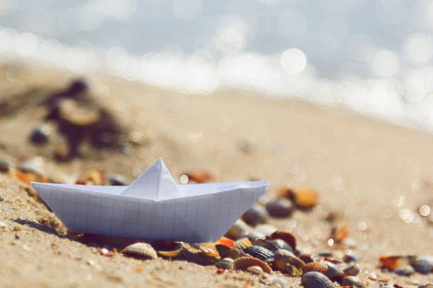 istock Paper ship by the sea. 841122606