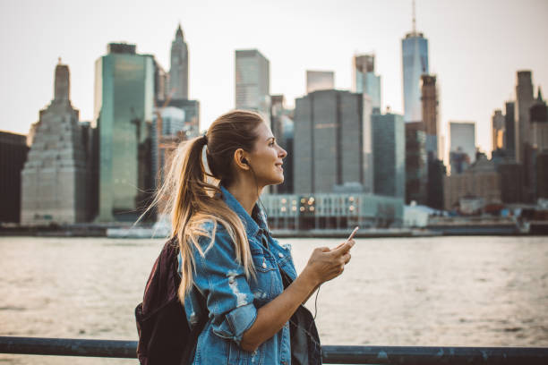 Exploring city Woman in New York  enjoying in skyline at dusk brooklyn new york photos stock pictures, royalty-free photos & images