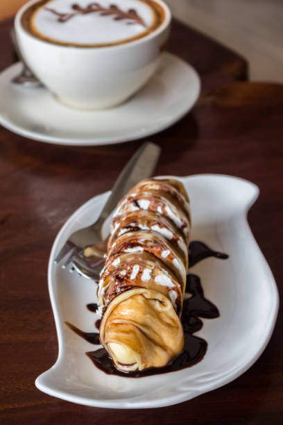 istock Banana crepe roll and with chocolate sauce. 841139692