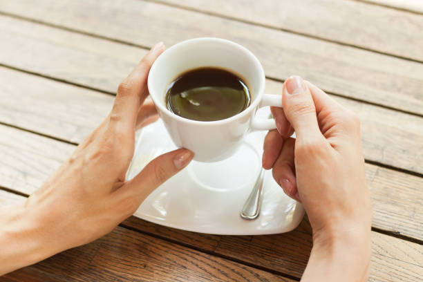 istock Hand with cup of coffee 841140812