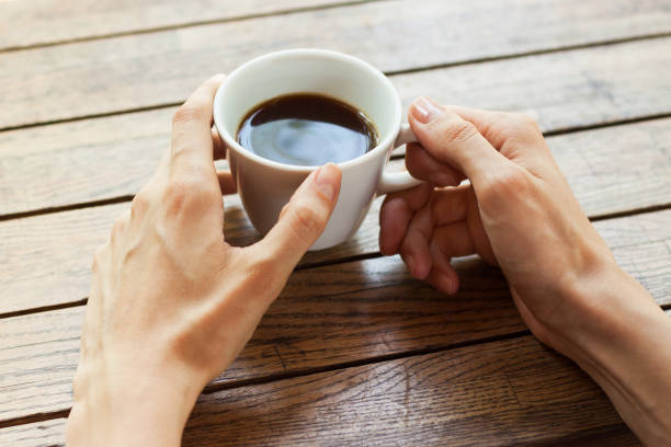 istock Hand with cup of coffee 841140960