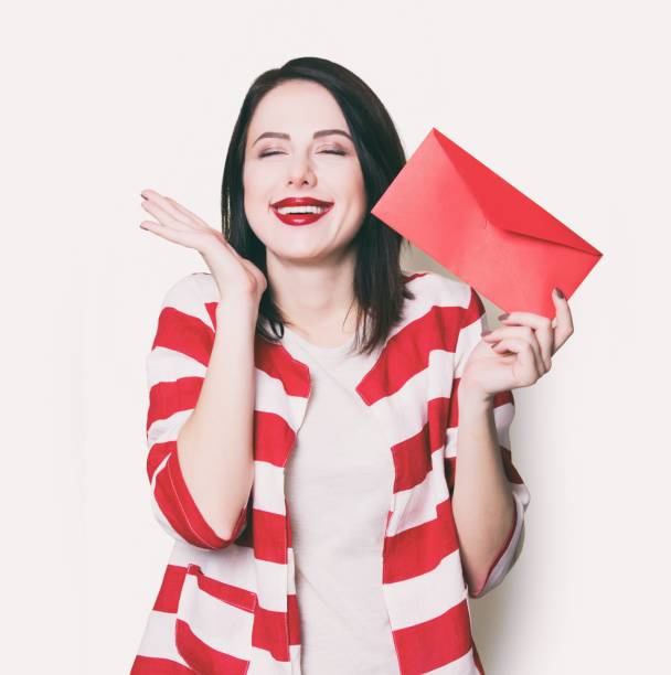 istock girl holding red gift 841147232