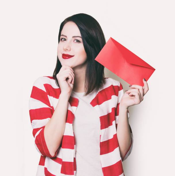 istock girl holding red gift 841147244