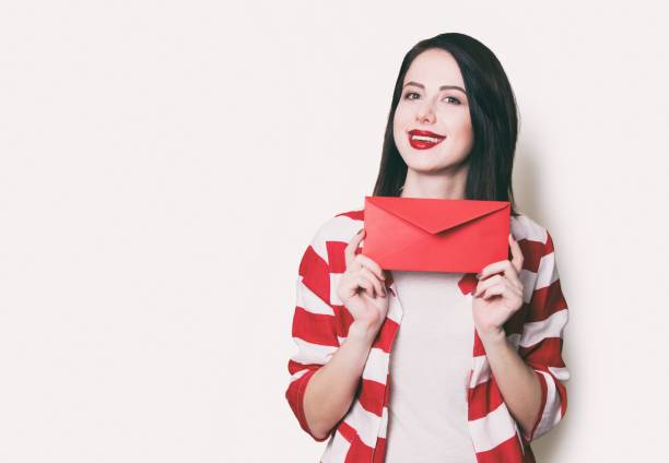 istock girl holding red gift 841147352