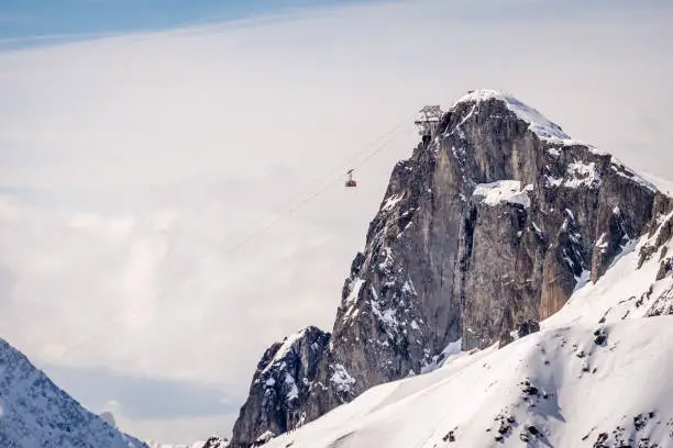 A cable car lift makes its way up the mountain in the Winter resort of Chamonix