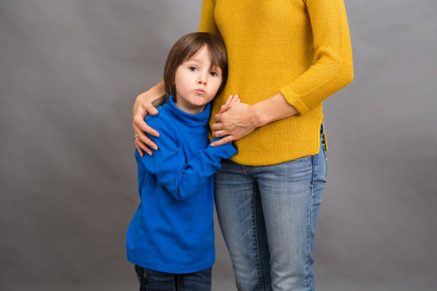 istock Sad little child, boy, hugging his mother at home, isolated image 841148280