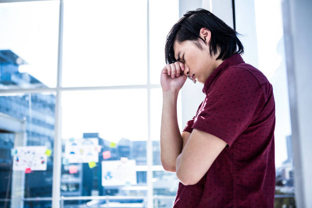 istock Worried creative businessman holding his head 841152156