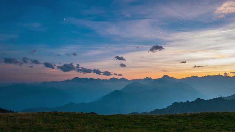 Day to night time lapse from high up on the Alps