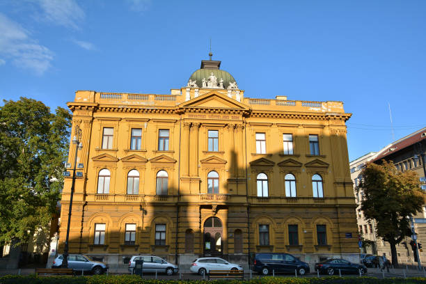 ZAGREB, CROATIA - JULY 14, 2017.  Old building architecture, top attraction for many tourists in the capital of Croatia, Zagreb city. Traffic on the streets.