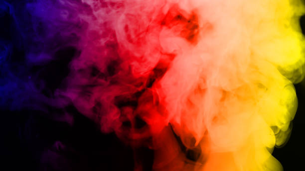 istock Colorful smoke on dark background 841159234