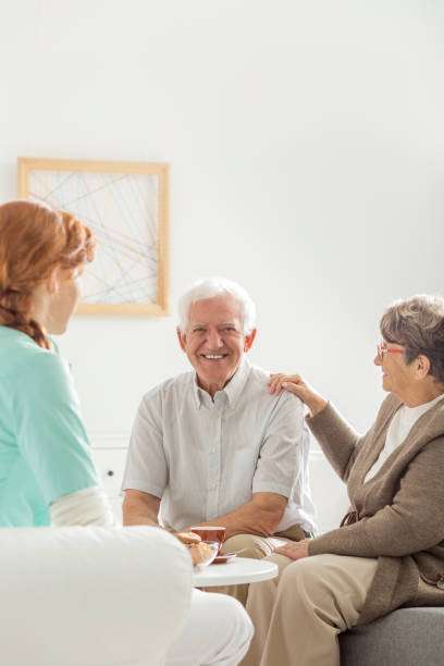istock Smiling senior sitting next to wife 841167884
