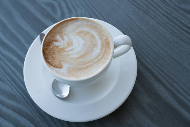 istock A cup of cappuccino on a dark table 841169948