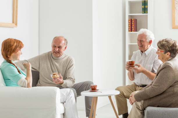 istock Senior shares cookies with nurse 841169970