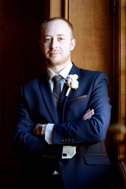 istock Handsome groom in suit in the hall 841174320