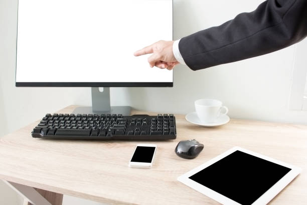 istock Businessman with finger touching screen of a computer in office 841177150