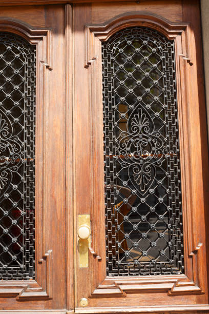 istock Retro styled wooden doors with iron details 841177628