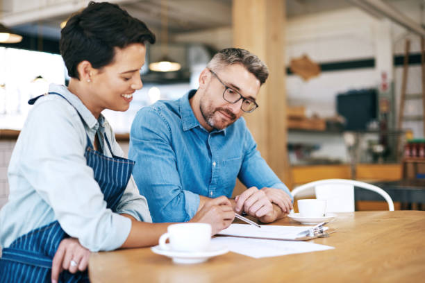 istock Balancing the coffee shop books 841179974